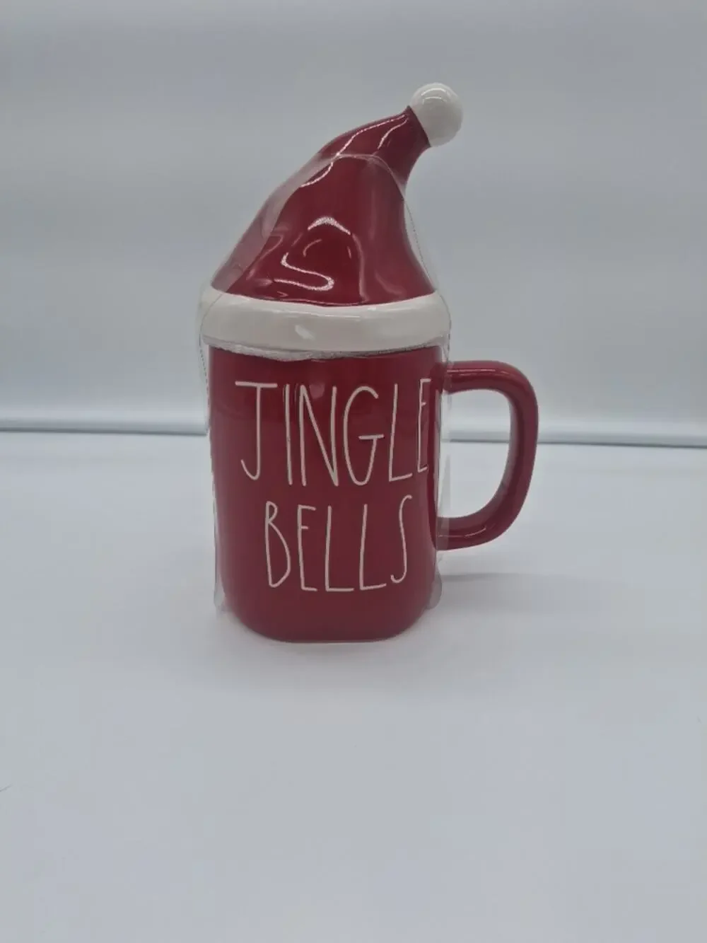 Brand New Rae Dunn Red Jingle Bells Christmas Mug with Santa Topper.
